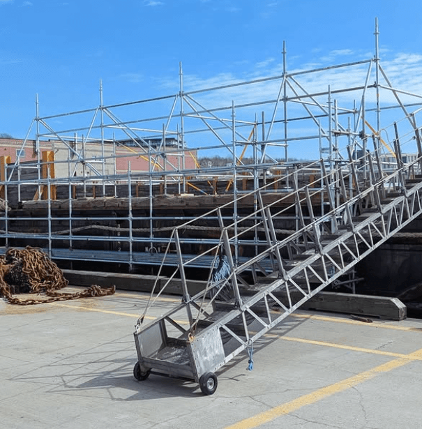 Scaffold structure staged for a design-build access plan
